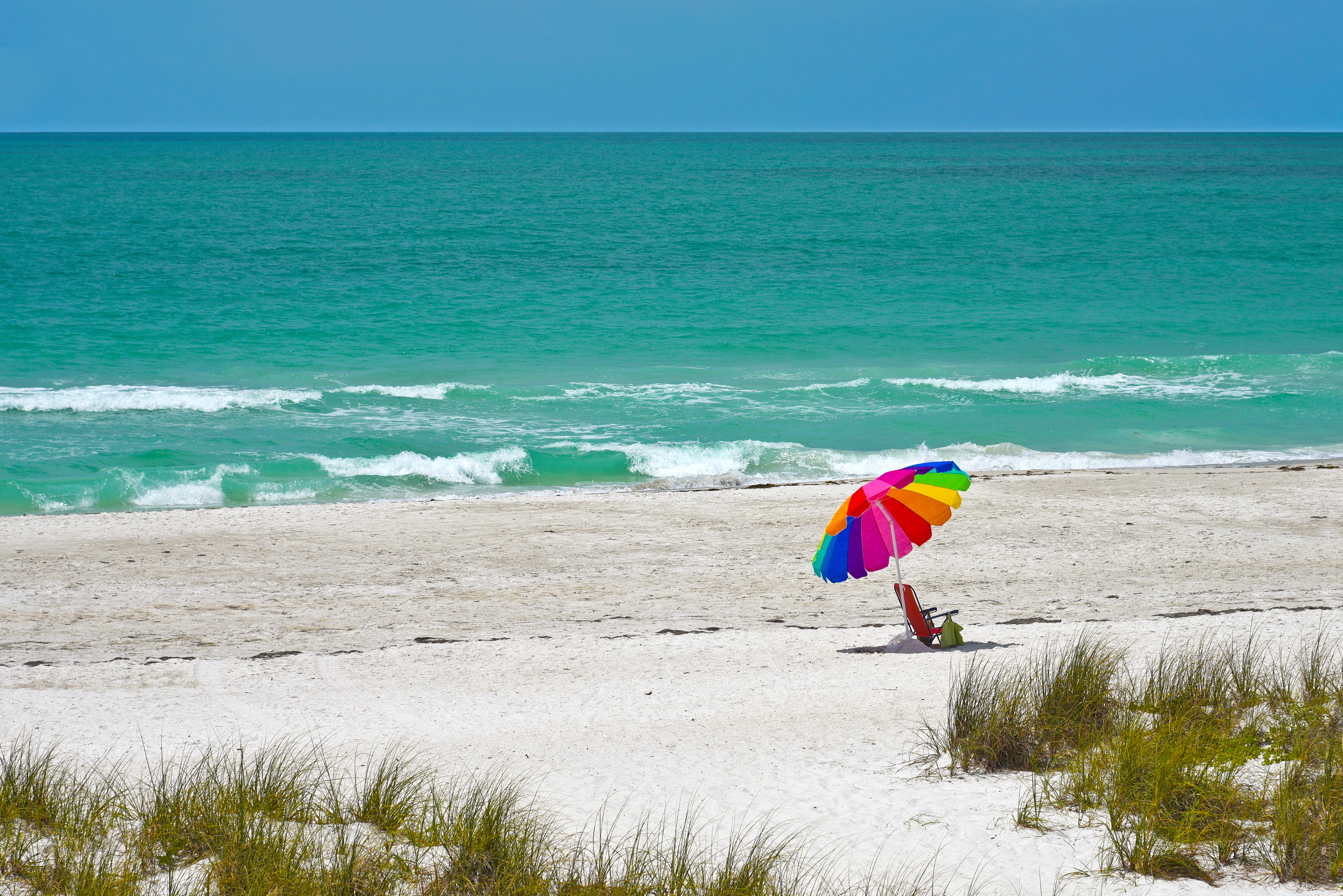 Beach Umbrella and Chair on the White Sand Beach of Anna Maria Island, Florida